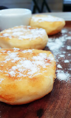 Three cheesecakes on the table in a cafe