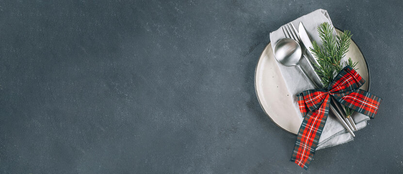 New Year's festive table setting with cutlery and decorations. Top view, flat lay