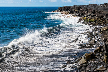 Waves Crashing Against Sea Cliffs Formed by Recent Lava Flows on Kaimu Black Sand Beach, Hawaii Island, Hawaii, USA