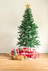 Christmas tree with red gifts in living room. decoration for Happy New Year and Christmas concept.