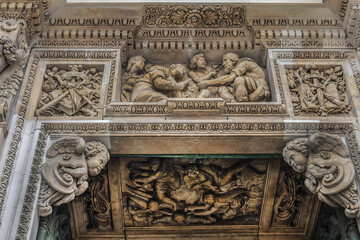 Architectural fragment of Milan Cathedral (Duomo di Milano, 1386), dedicated to St Mary of the Nativity (Santa Maria Nascente), with Gothic and Lombard Romanesque style. Milan, Italy.