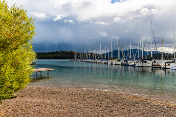 Sailboats Moored on Flathead Lake With Mountains In The Background, Dayton, Montana, USA