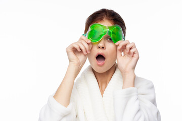 cheerful woman in a white robe facial care rejuvenation lifting