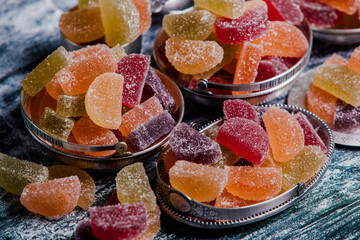 Naklejka na ściany i meble Dessert marmalade in the form of lemon and orange slices. The sweetness of jelly candy.