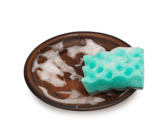 Scouring sponge in foam on a plate, dishwashing