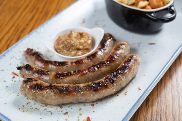 Grilled sausages with mustard and bread toast