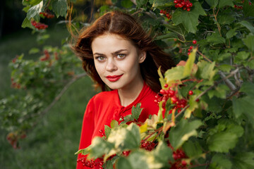 pretty woman in red shirt bush nature freedom