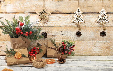 Empty rustic table with live Christmas tree in eco bag and homemade gift boxes and decorations.Christmas and New Year mockup for design and product demonstration, concept of zero waste,
