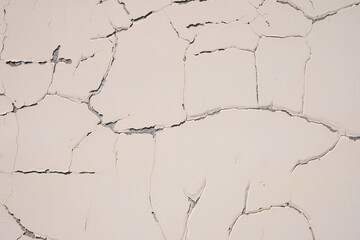 Overlay for your design. Background texture of a white cement wall with a crack. A crack in the old wall. High quality photo