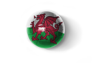 realistic football ball with colorfull national flag of wales on the white background.