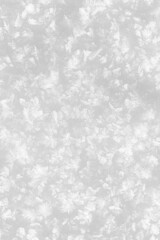 Snowy white background. Close-up snowflakes texture.