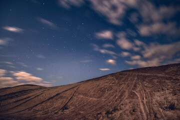 Abstract landscape with sandy dune at night