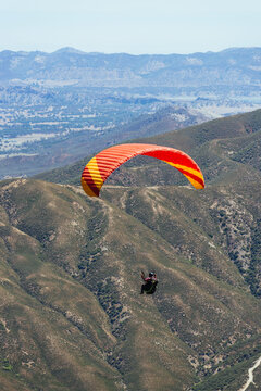 Paragliding Pilot Flying a Paraglider