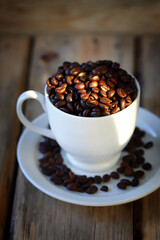 Selective focus. Coffee beans in a cup.