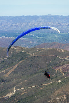 Paragliding Pilot Flying a Paraglider