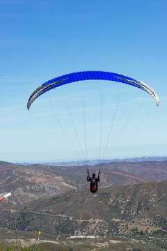 Paragliding Pilot Flying a Paraglider