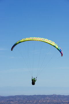 Paragliding Pilot Flying a Paraglider