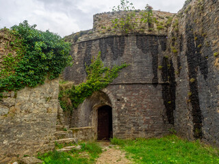 Fototapeta na wymiar One of four rounded towers of old Spanish fortress in Herceg Novi. 
