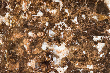Brown marble pattern with white veins. Close-up photo texture