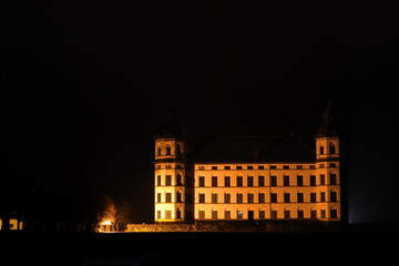 Castle by night. Large old white building with a black sky or background. Skokloster, outside Stockholm, Sweden, Scandinavia, Europe.