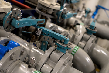 Industrial valves, pipes in modern offshore ship's engine room