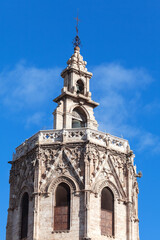 Steeple of gothic church . Belfry of medieval cathedral . Christian cross on the church top 