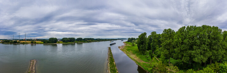 Fototapeta na wymiar Panoramic view of the Rhine river near Leverkusen, Germany. Drone photography