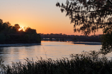 
Po river at sunset, autumn colors. Cremona, Italy