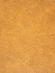 Suede surface in beige and mustard color as a background. High quality photo