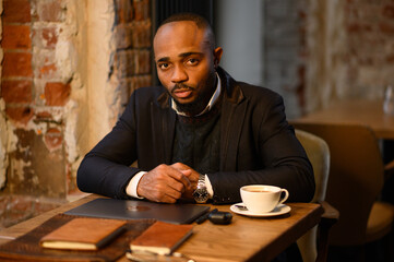 Confident young african man look at webcam conference video calling in office, happy mixed race...