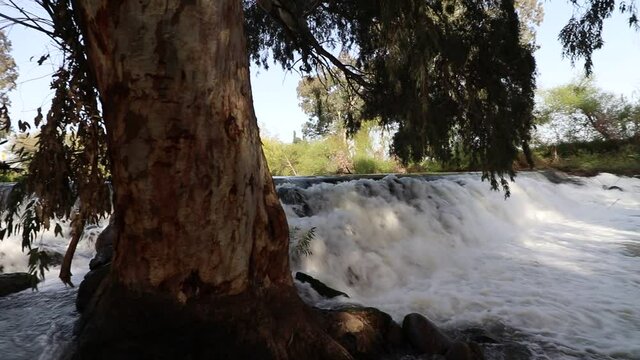 A waterfall of fresh and cold water, in the historic Jordan Dam, in the ancient water diversion facility in the village of Blum in the northern Golan Heights in Israel.