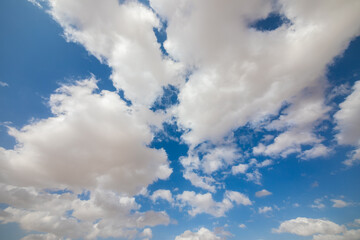 Very wide view on a bright fluffy clouds at sky