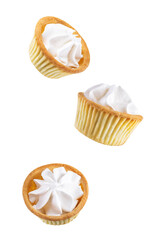 Sweet tartlets with cream on a white isolated background