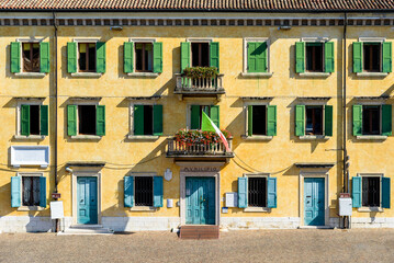 Obraz premium Facade of a public building of the Italian municipality facing the sun.