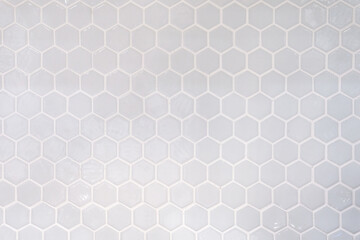 Tiles. A white marble wall with hexagon tiles for texture and background. White marble wall with hexagon pattern.