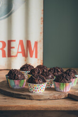 chocolate banana muffins on a wooden table