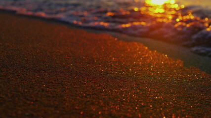 Closeup view of inspiring seascape with beautiful ocean waves reflecting sunset
