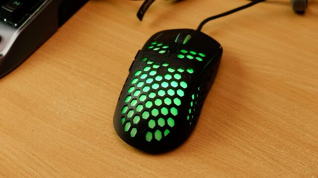 Close Up Of Computer Rgb Gaming Mouse, Illuminated By Colored Led