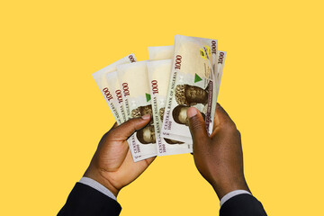 Black Hands in suit holding 3D rendered Nigerian Naira notes
