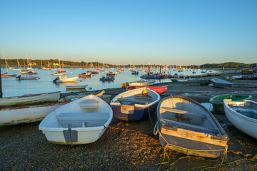 Rowing Boats and Sailboats, Anchored and Aground at Low Tide, Itchenor, Chichester Harbour, UK A Tranquil Evening Scene.