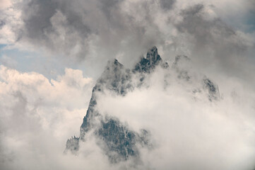 Beautiful closeup view of cloudy Italian Dolomite mountains in Alps during summer day