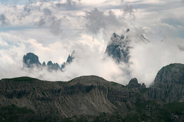 Beautiful closeup view of cloudy Italian Dolomite mountains in Alps during summer day
