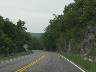Winding road with rock walls along the road