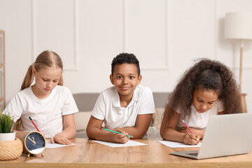 Little pupils studying online at home