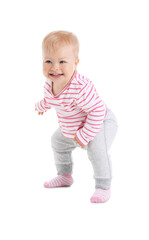 Cute baby girl learning to walk on white background