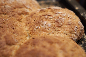 Small loaves of homemade whole wheat bread. Selective focus