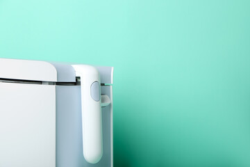 Modern deep fryer on color background