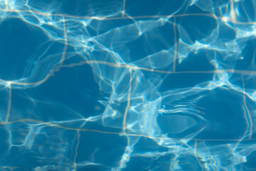Blue ripped water in the swimming pool. Swimming pool water surface background