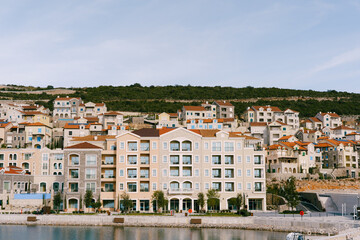 Fototapeta na wymiar Expensive modern buildings in the village of Lustica Bay. Montenegro
