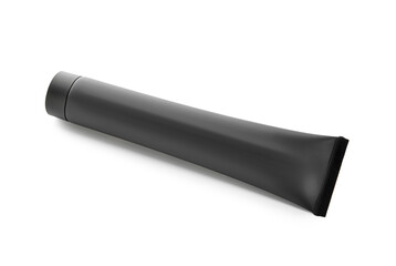 Tube of black toothpaste with activated carbon on white background